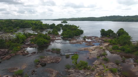 Motorised-canoe-landing-by-drone-view-in-saut-Maripa-French-Guiana-Brazil